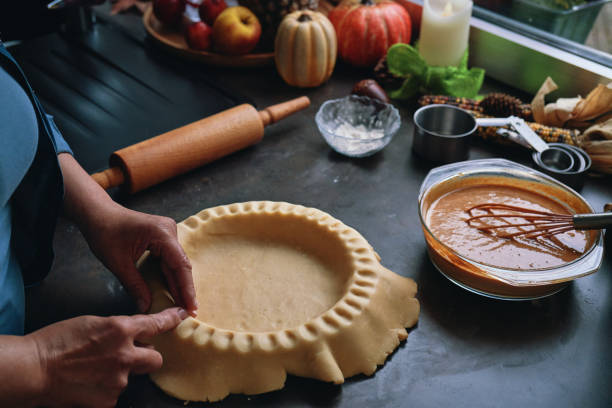 istock Preparing Pumpkin Pie for the Holidays in Domestic Kitchen 1629950638