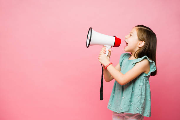 istock Smart little girl yelling using a megaphone 1629958701