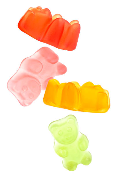 istock Flying delicious jelly bears isolated on a white background. Marmalade bears. 1629959971