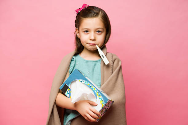 Upset kid sick with a cold and a fever