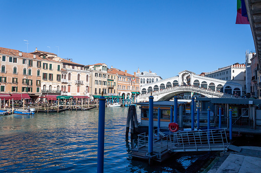 Venice, Italy - February 12, 2022: The Rialto Bridge seen from the typical vaporetto stop.
