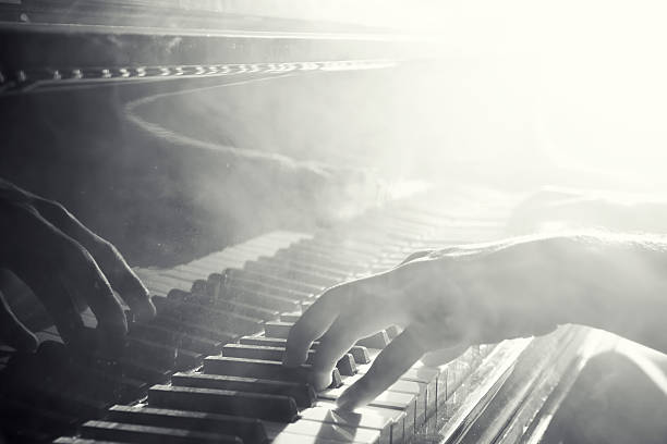 Reflection of hand playing the piano