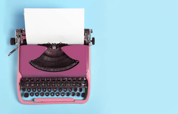 istock Copywriter. Vintage typewriter on light blue background, top view. Space for text 1629978783