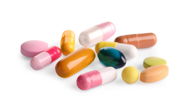 istock Many different pills isolated on white. Medicinal treatment 1629978808