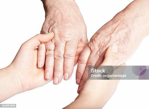 Velha E Jovens Mão - Fotografias de stock e mais imagens de Antigo - Antigo, Jovem Adulto, Mãos Juntas