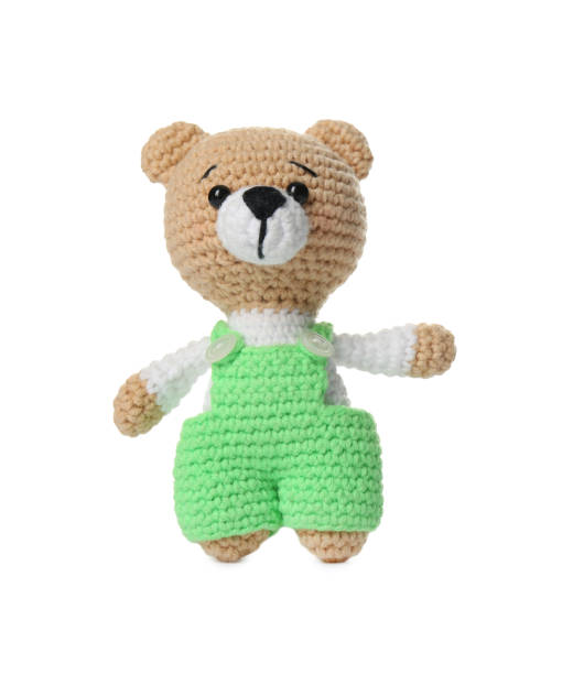 istock One crochet bear isolated on white. Children's toy 1629989616