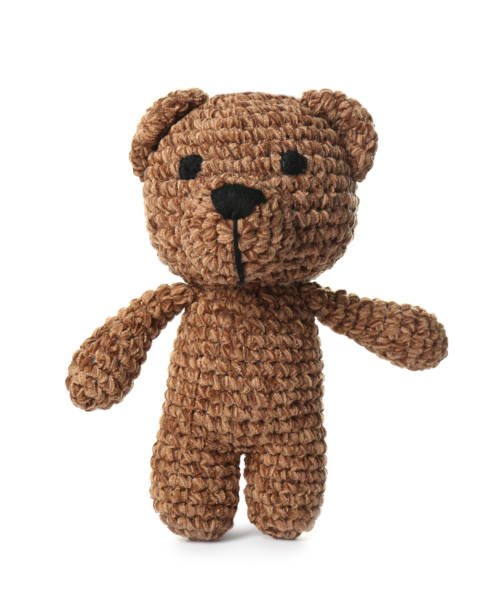 istock One crochet bear isolated on white. Children's toy 1629989619