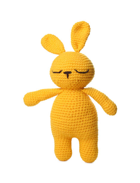 istock One crochet rabbit isolated on white. Children's toy 1629989624