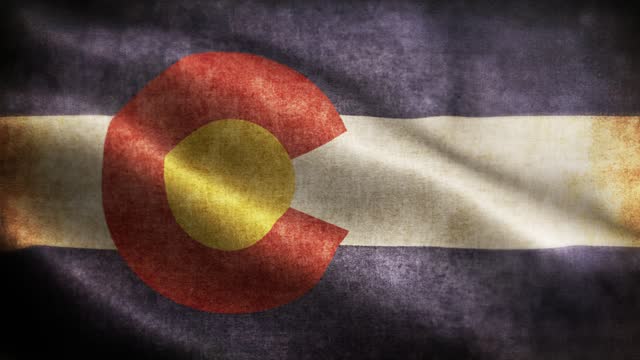 American State Closeup of grunge Colorado waving flag loopable stock video