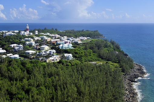 St. David's Island, St. George's Parish, Bermuda: eastern part of the island with St. David's Lighthouse - octagonal limestone tower completed in 1879 and still fully operational, painted white with a red daymark. The optics consist of a 2nd order Fresnel lens.