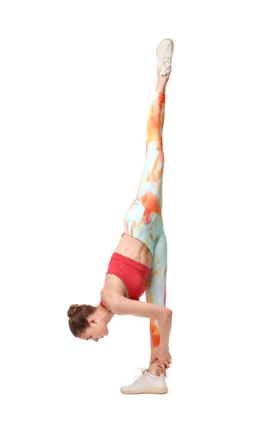 istock Yoga workout. Young woman stretching on white background 1630021361