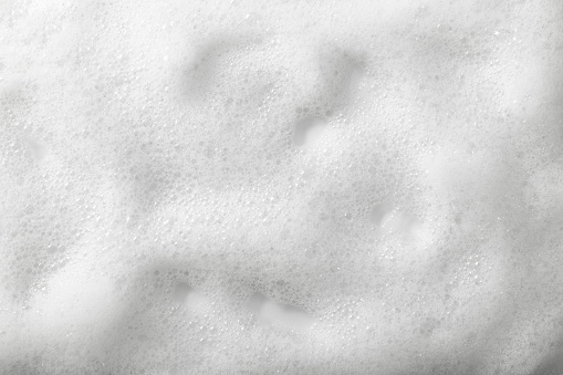 Foam on a white background. Shampoos, detergents, washing and cleaning. Car wash.