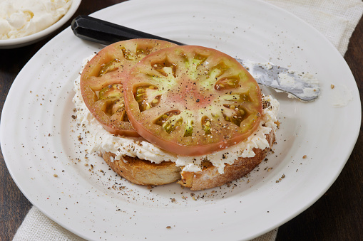 Open Faced Cream Cheese and Heirloom Tomato Sandwich on Toasted Sourdough Bread
