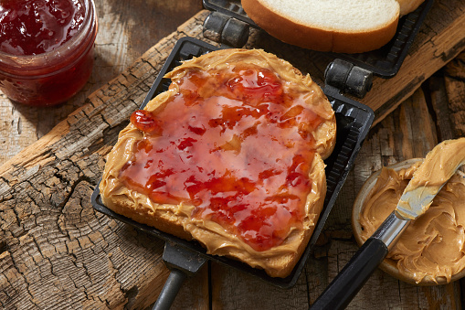 Campfire Peanut Butter and Strawberry Jam Sandwich with Kettle Potato Chips