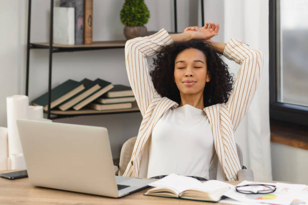 istock Business woman taking break from work think positive dreaming about something good 1630032377