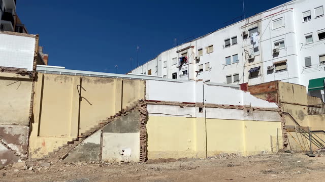 Traces of rooms in demolished building wall