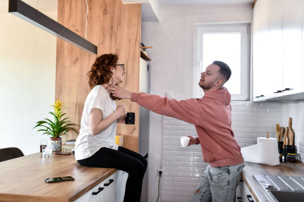istock Male Checking Girlfriend's Heart Rate While Both Drink Coffee Together 1630046053