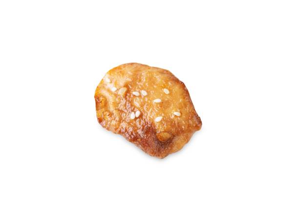 istock Spice teriyaki chicken with sesame seeds on a white isolated background 1630056752