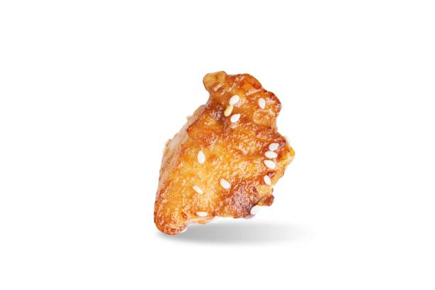 istock Spice teriyaki chicken with sesame seeds on a white isolated background 1630063222