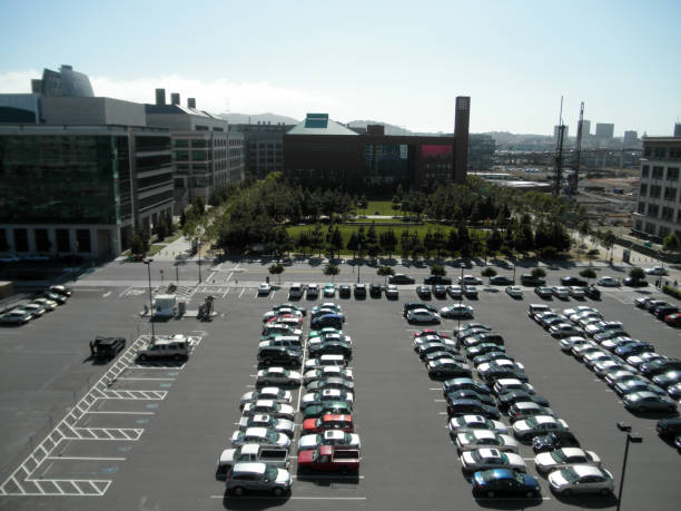 Aerial View of Parking Lot, UCSF Mission Bay Campus and Construction San Francisco - June 18, 2010: An aerial view of a parking lot, the UCSF Mission Bay Campus and some construction sites. The parking lot is full of cars and buses. The UCSF Mission Bay Campus is a modern complex of buildings for research and education in health sciences. The construction sites are part of the ongoing development and expansion of the area. san francisco county city california urban scene stock pictures, royalty-free photos & images