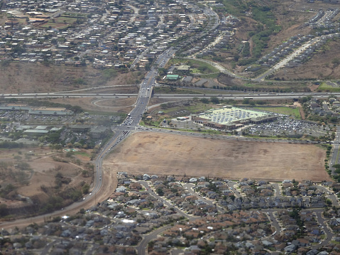 Oahu - July 8, 2015:  Aerial of Walmart, H-1 Highway and city of Kapiolei seen from the sky.