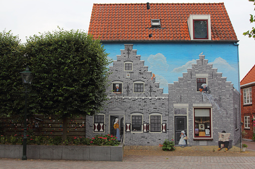 a beautiful graffiti / wall painting of a medieval house in Zierikzee (Zeeland), the Netherlands
