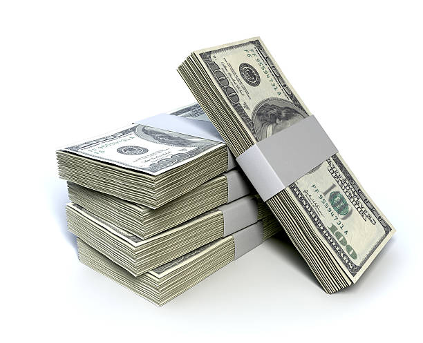 Dollar Bill Bundles Pile A stack of bundled one hundred dollar bill notes on an isolated background Bundle stock pictures, royalty-free photos & images