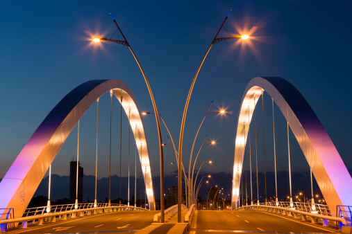 The new Basarab Overpass Bridge illuminated at twilight in Bucharest, Romania, one of the largest suspension bridges in Europe.