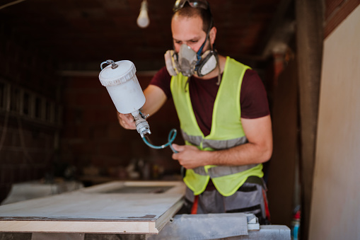 Carpenter painting his masterpiece