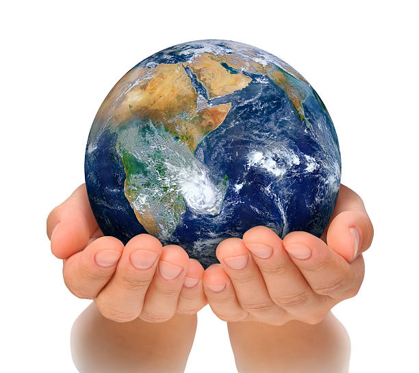 Hands of woman holding globe, Africa and Near East stock photo