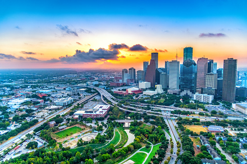 The summer sunrise over downtown Houston Texas shot from a helicopter at about 500 feet in altitude.