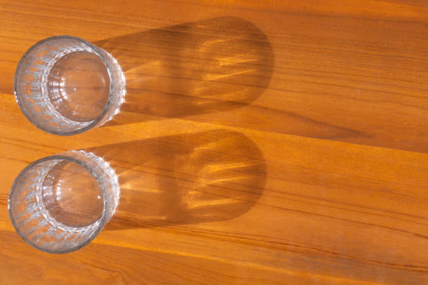 istock Two beer glasses over wooden  background 1630260434