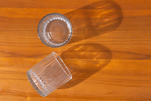 istock Two beer glasses over wooden  background 1630260435