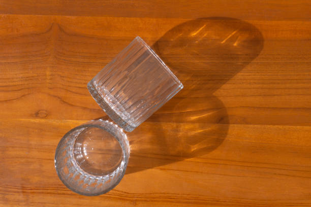 istock Two beer glasses over wooden  background 1630261457