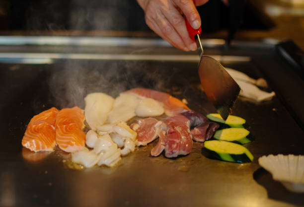 istock Chef cooking in Japanese teppanyaki restaurant 1630266227