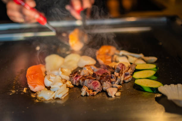 istock Chef cooking in Japanese teppanyaki restaurant 1630270215