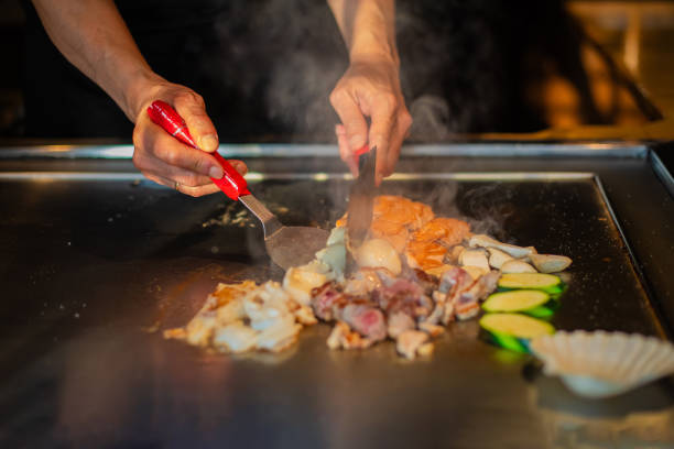istock Chef cooking in Japanese teppanyaki restaurant 1630271503