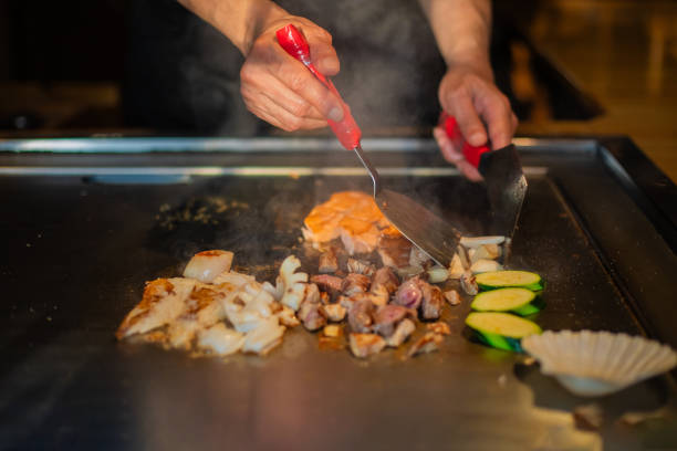 istock Chef cooking in Japanese teppanyaki restaurant 1630272009