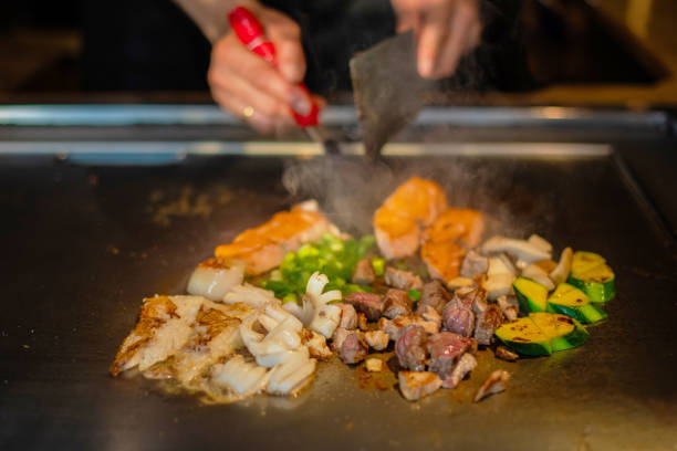 istock Chef cooking in Japanese teppanyaki restaurant 1630276711