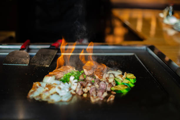 istock Chef cooking in Japanese teppanyaki restaurant 1630279425