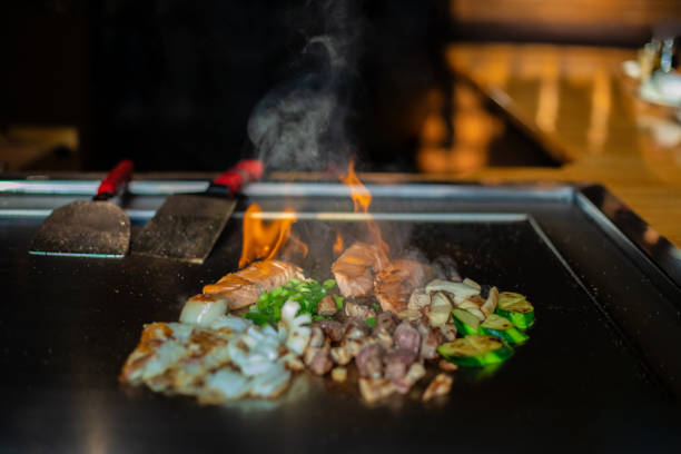 istock Chef cooking in Japanese teppanyaki restaurant 1630279427