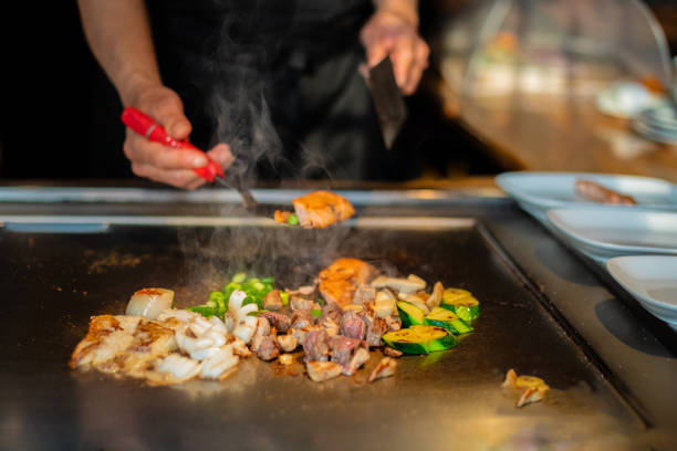 istock Chef cooking in Japanese teppanyaki restaurant 1630279932