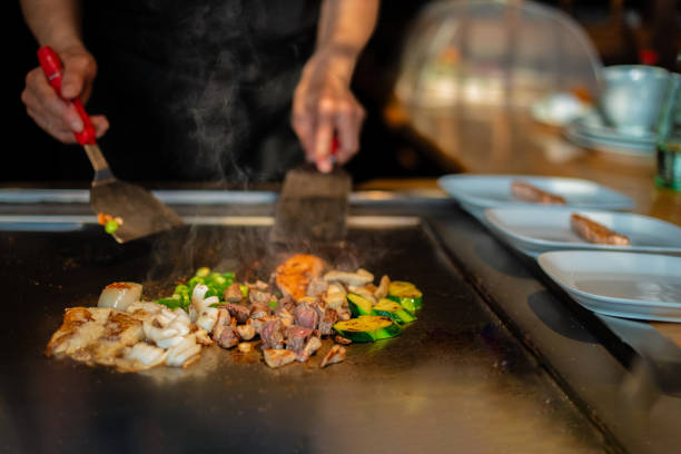 istock Chef cooking in Japanese teppanyaki restaurant 1630281026