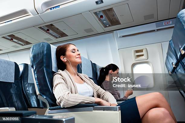 During The Flight Stock Photo - Download Image Now - Airplane, Relaxation, Commercial Airplane