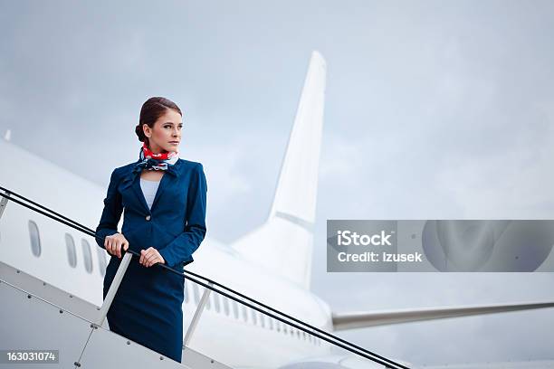 Beautiful Air Stewardess Stock Photo - Download Image Now - Cabin Crew, Portrait, Airplane