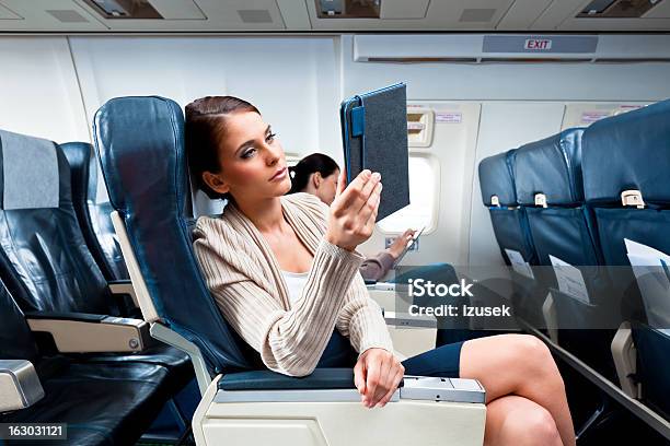 During The Flight Stock Photo - Download Image Now - Airplane, Sitting, 20-24 Years