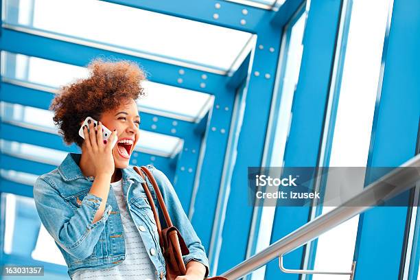 Happy Teen Girl With Mobile Phone Stock Photo - Download Image Now - Ecstatic, Excitement, Telephone