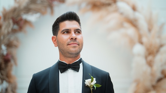 A portrait of a handsome groom.