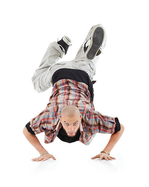 istock Breakdancer stands on hands and looks at camera 163032270