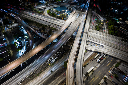 Drone shot of 10/110 interchange on the edge of Downtown Los Angeles lit up at night